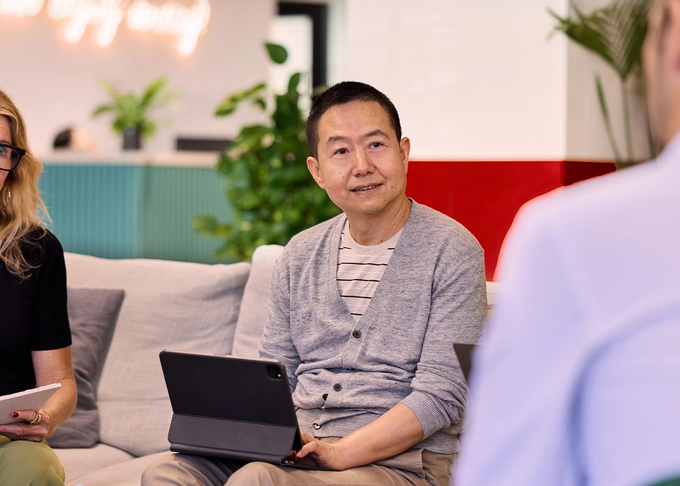 Man working on laptop smiling 1400x1400.webp